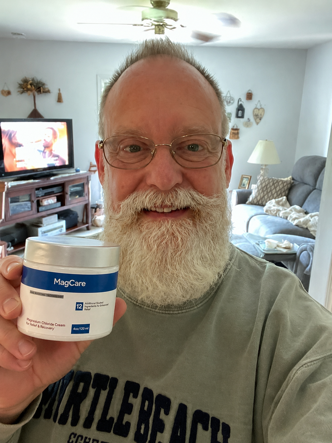 Chris holding MagCare Magnesium Cream
