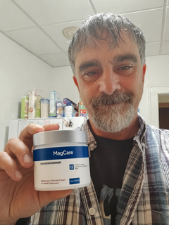 Michael W. holding MagCare Magnesium Cream